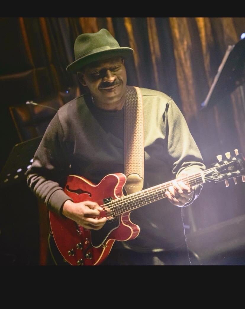 Wil A. Crosby performing on electric guitar