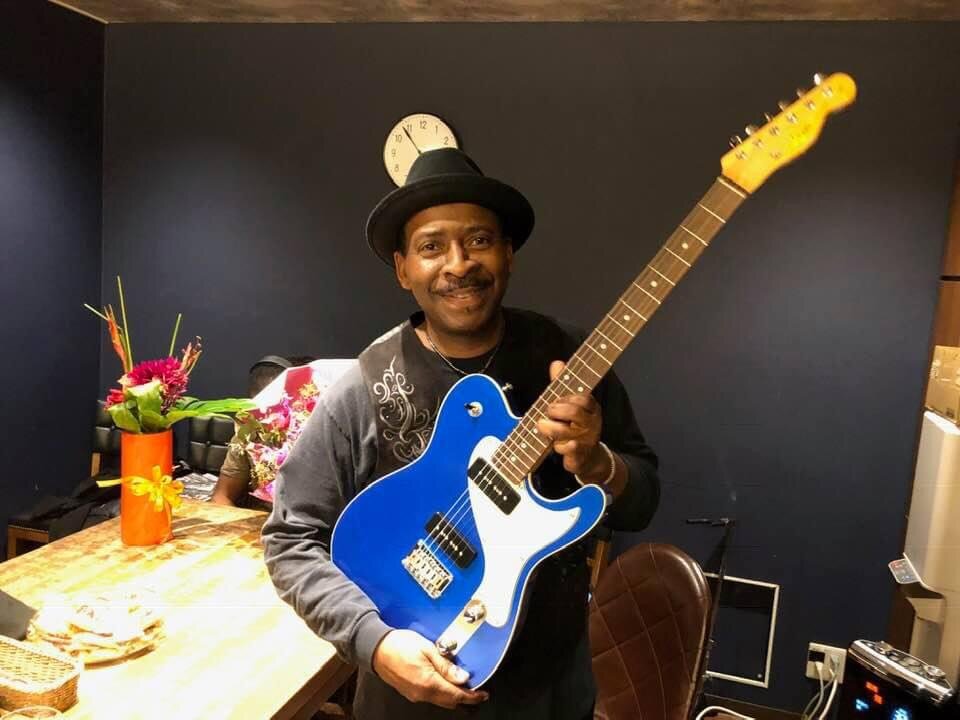 Wil A. Crosby holding the Moon Telecaster presented at the Blue Note in Japan